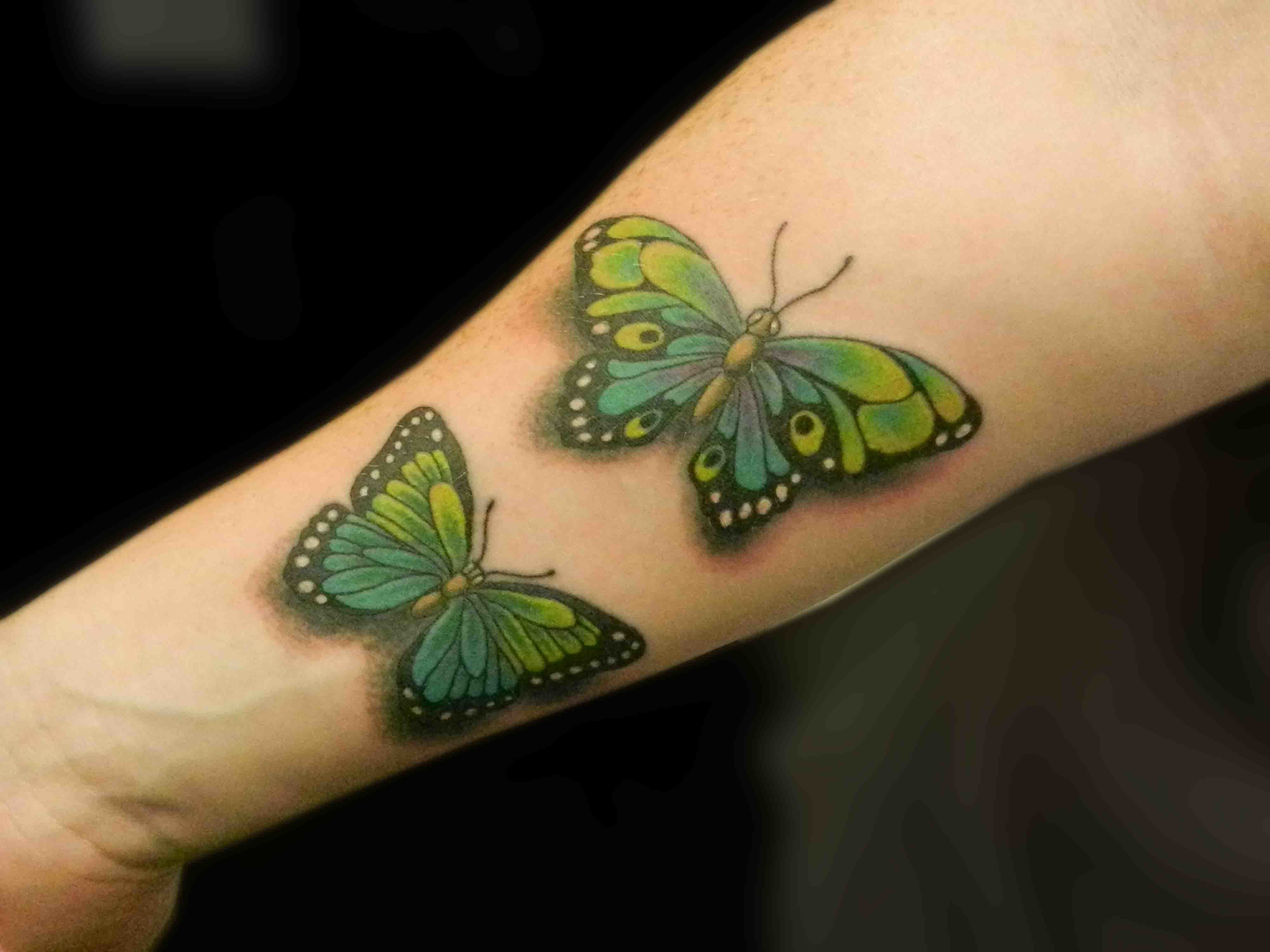 img/21_butterfly-arm-tattoos-a-guide-to-the-symbolism-and-styles.webp
