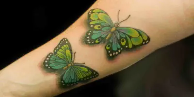 img/21_butterfly-arm-tattoos-a-guide-to-the-symbolism-and-styles.webp
